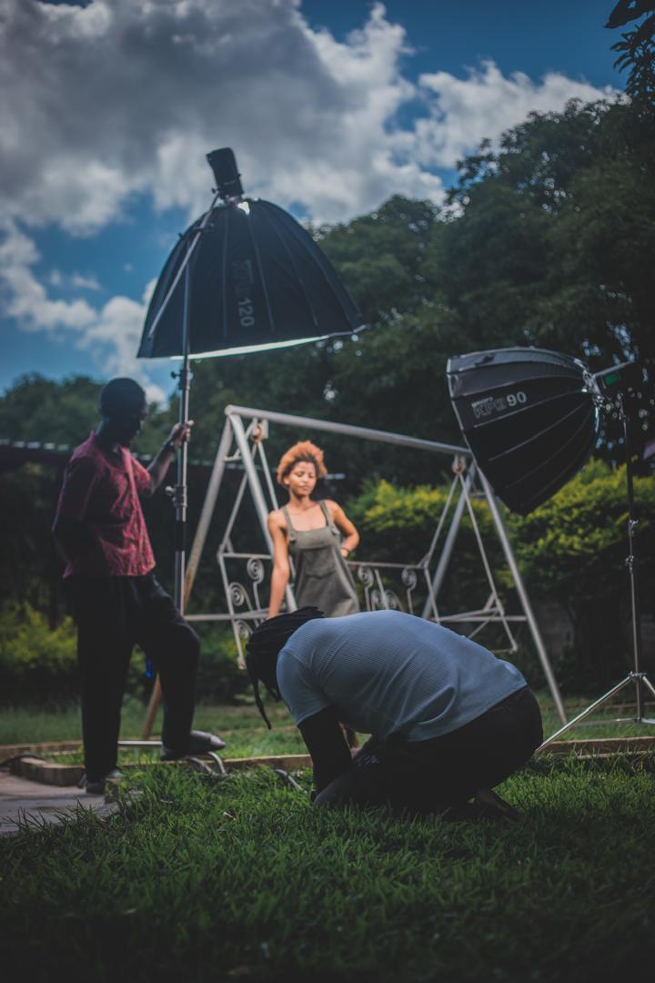 An outdoor photo shoot lit with softboxes